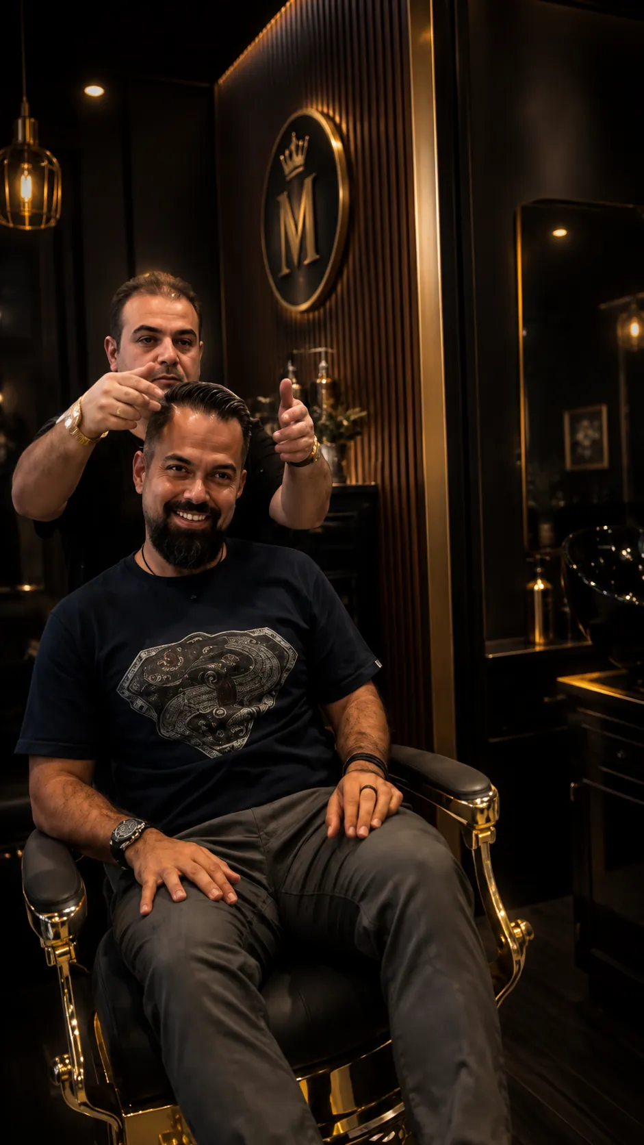 Client smiling in the gold barber chair after a fresh cut at Yad Barbershop